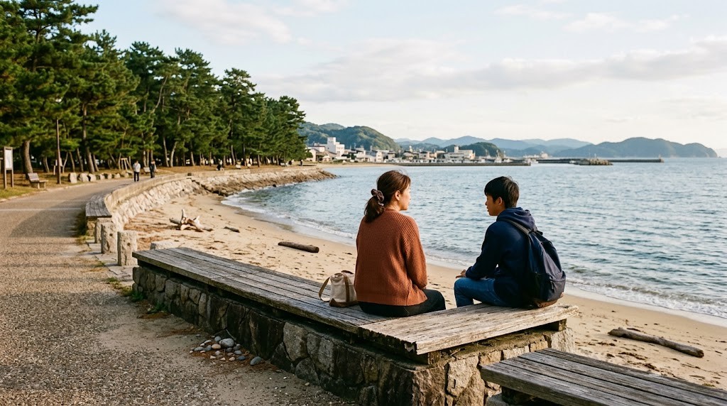 松林のある海辺の遊歩道で、母親と高校生の息子が並んで座り海を見ながら話している